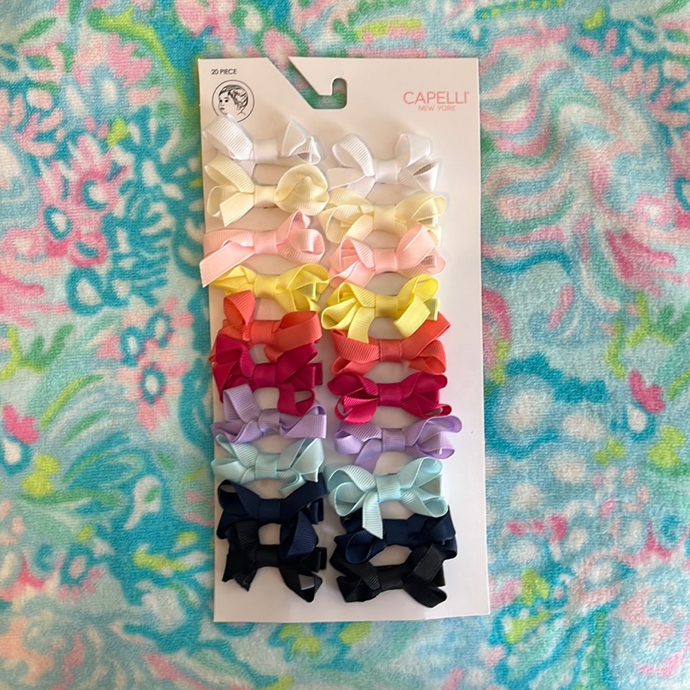 Brand new (never has been opened ) alligator clip bundle of 10 bows .